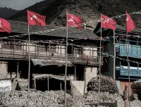 house with communist flag in rolpa guerrilla trekking