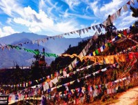 prayer flags and buddha statue